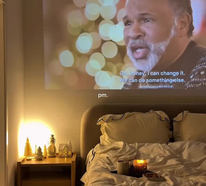 A cozy fall movie night setup in bed
