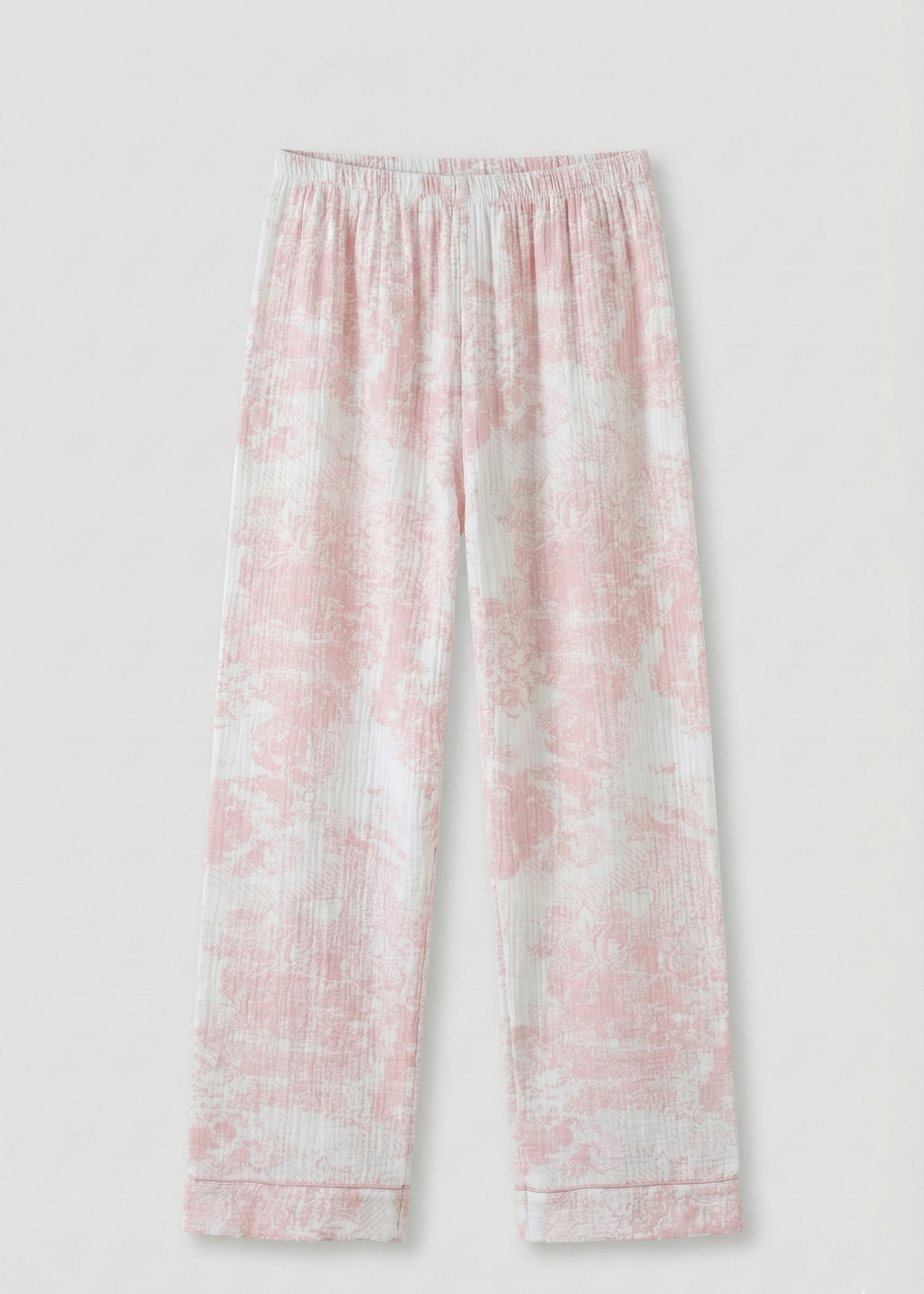 Pink and white tie-dye pants on a light gray background