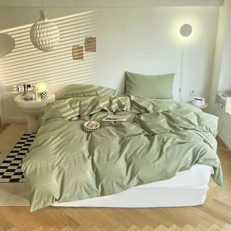 A cozy fall bedroom styled with forest green