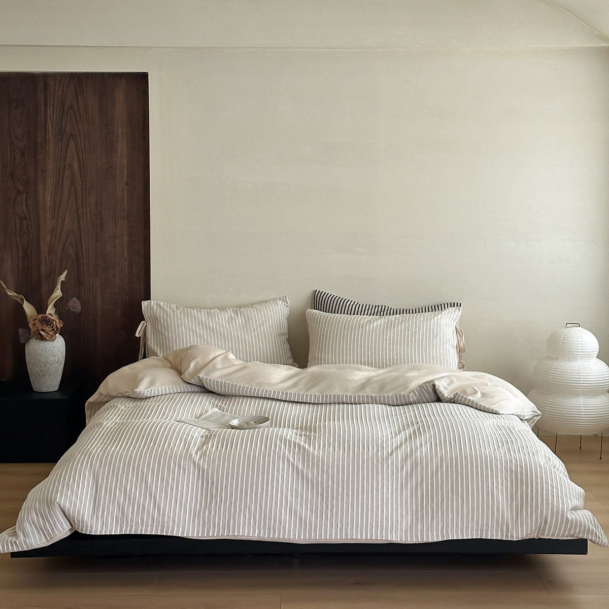 airy neutral bedroom bedding setup modern stripe textured finish styling